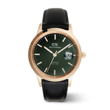 Men’s Daniel Wellington Iconic Sheffield Automatic Rose Gold watch featuring an emerald green enamel dial, rose gold stainless steel case, luminous markers, magnified date display, and a black leather strap.