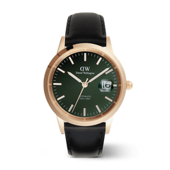 Men’s Daniel Wellington Iconic Sheffield Automatic Rose Gold watch featuring an emerald green enamel dial, rose gold stainless steel case, luminous markers, magnified date display, and a black leather strap.