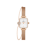 Rectangular rose gold watch with a white dial and crystal bezel, paired with a matching mesh strap and a delicate bracelet featuring a pave crystal pendant.