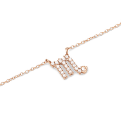 Delicate rose gold chain necklace featuring a Scorpio zodiac pendant adorned with hand-set sparkling crystals.