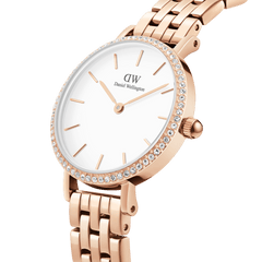 Close-up of the Petite Lumine Bezel 5-Link Melrose watch, featuring a rose gold stainless steel bracelet, a white minimalist dial, and a bezel set with sparkling crystals for an elegant, refined finish.