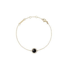 Delicate gold bracelet featuring a slim adjustable chain and a central domed black agate stone, encircled by a row of sparkling white cubic zirconia crystals.