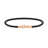 Slim black leather bracelet with a rose gold PVD-plated stainless steel lobster clasp, featuring minimalist design and Daniel Wellington branding.