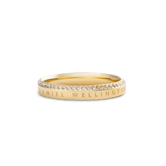 Classic Aura Ring Gold featuring a slim gold band with a row of white cubic zirconia crystals along the chamfered edge and Daniel Wellington engraving, offering a refined and elegant look.