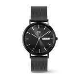 Classic men’s watch with a black textured dial, day and date display, and a sleek black stainless steel mesh strap by Daniel Wellington. The minimalist design and polished finish offer a refined, modern look suitable for both formal and everyday wear.