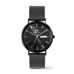 Classic men’s watch with a black textured dial, day and date display, and a sleek black stainless steel mesh strap by Daniel Wellington. The minimalist design and polished finish offer a refined, modern look suitable for both formal and everyday wear.