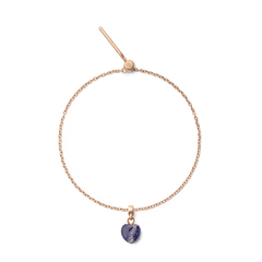 Delicate rose gold bracelet featuring a heart-shaped blue spot stone charm with natural veining, designed for a refined and modern jewellery look.