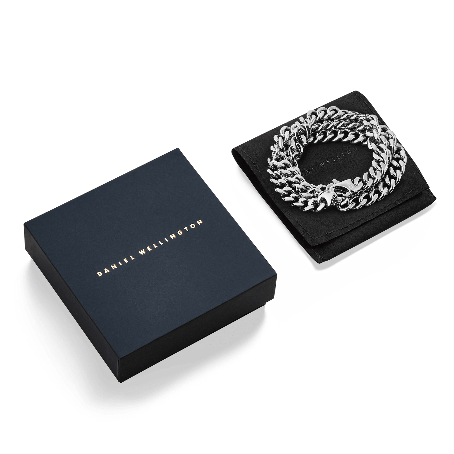 Ellipse Cuban Chain Necklace Silver presented coiled on a black pouch beside an elegant Daniel Wellington gift box, showcasing its polished Cuban links and refined packaging.