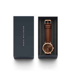 Classic Multi-Eye St Mawes Amber Rose Gold watch with an amber dial and brown leather strap, elegantly presented in a dark Daniel Wellington gift box.