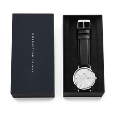 Classic Day Display Sheffield Silver watch with a black leather strap and white dial, presented in an elegant Daniel Wellington gift box.