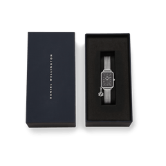 Quadro Crystal Zodiac Sterling Set presented in an elegant Daniel Wellington gift box, featuring a rectangular silver watch with a black mother of pearl dial, crystal-set bezel, mesh strap, and zodiac-inspired charm.