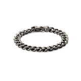 Graphite Cuban chain bracelet with chunky, polished stainless steel links and a matching lobster clasp, shown laid flat on a plain background.