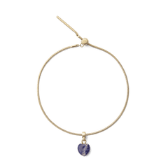 Gold snake chain bracelet featuring a heart-shaped blue spot stone charm with unique natural veining, set in gold PVD-plated stainless steel.