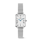 Rectangular silver women’s watch with a white guilloché dial, bold Roman numerals, blue hands, date window at six o’clock, and an adjustable polished mesh strap.