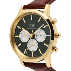 Close-up of the Iconic Chronograph St Mawes Emerald Panda Gold watch, showcasing its emerald green dial with white sub-dials, gold stainless steel case, and brown leather strap.
