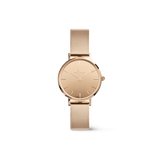 Petite Reflection Rose Gold women’s watch featuring a round mirror glass dial, minimalist face, and a polished rose gold mesh strap with an elegant, contemporary design.