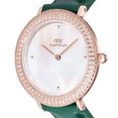 Close-up of the Crystalline Bezel Green Croc Rose Gold watch, highlighting its mother of pearl dial, rose gold case set with sparkling crystals, and emerald green crocodile-textured leather strap.