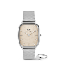 Rectangular silver Daniel Wellington watch with a textured light dial and mesh strap, paired with a polished silver mini signet ring featuring a smooth, rounded face.