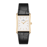 Rectangular gold watch with a white minimalist dial, gold markers and hands, paired with a black crocodile-embossed leather strap. The refined design highlights the elegant contrast between the polished gold case and textured strap.