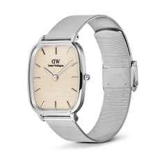 Daniel Wellington Marlon Wire Linen Silver watch featuring a cushion-shaped stainless steel case, linen-textured beige dial, minimalist hour markers, and a polished silver mesh strap with an adjustable clasp.