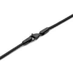 Detail of the Tide Mesh Necklace Black 1.8 showing the polished black lobster clasp and fine stainless steel mesh chain, highlighting its secure fastening and contemporary design.