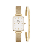 Quadro Pressed Evergold & Classic Bracelet set featuring a rectangular gold-tone watch with a white minimalist dial and a matching slim gold cuff bracelet engraved with the Daniel Wellington signature. Both pieces have a polished finish and are crafted from high-quality steel, offering a refined and elegant look.