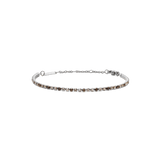 Slim silver tennis bracelet featuring a row of honey-toned Preciosa crystals in a gradient pattern, finished with an adjustable chain and secure lobster clasp.