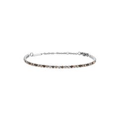 Slim silver tennis bracelet featuring a row of honey-toned Preciosa crystals in a gradient pattern, finished with an adjustable chain and secure lobster clasp.