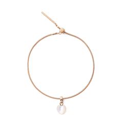 Rose gold bracelet featuring a heart-shaped mother of pearl charm, highlighting a smooth iridescent finish and an adjustable, elegant design.