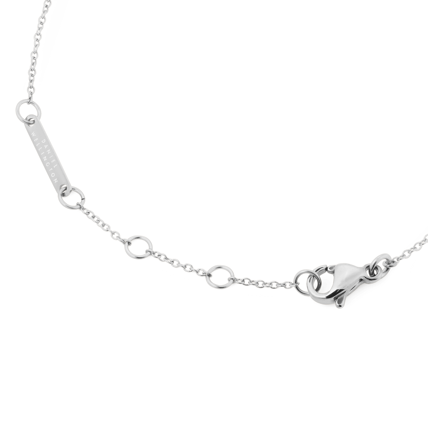 Detail of the Mirelle Infinity Bracelet Silver showing the adjustable polished silver chain, secure lobster clasp, and Daniel Wellington engraved tag.