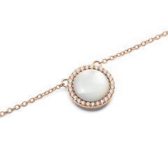 Close-up of the Audrey Necklace Mother of Pearl Rose Gold, showcasing a domed mother of pearl pendant surrounded by a halo of sparkling white cubic zirconia crystals on a delicate rose gold chain.