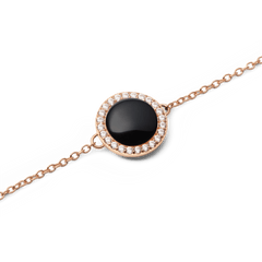 Close-up of Audrey Bracelet Black Agathe Rose Gold with black agate centre and white cubic zirconia on a rose gold chain.