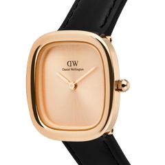 Close-up of the Margot Sheffield Unitone Sunray Rose Gold watch, showcasing its polished square rose gold case, minimalist sunray dial, and slim black leather strap.