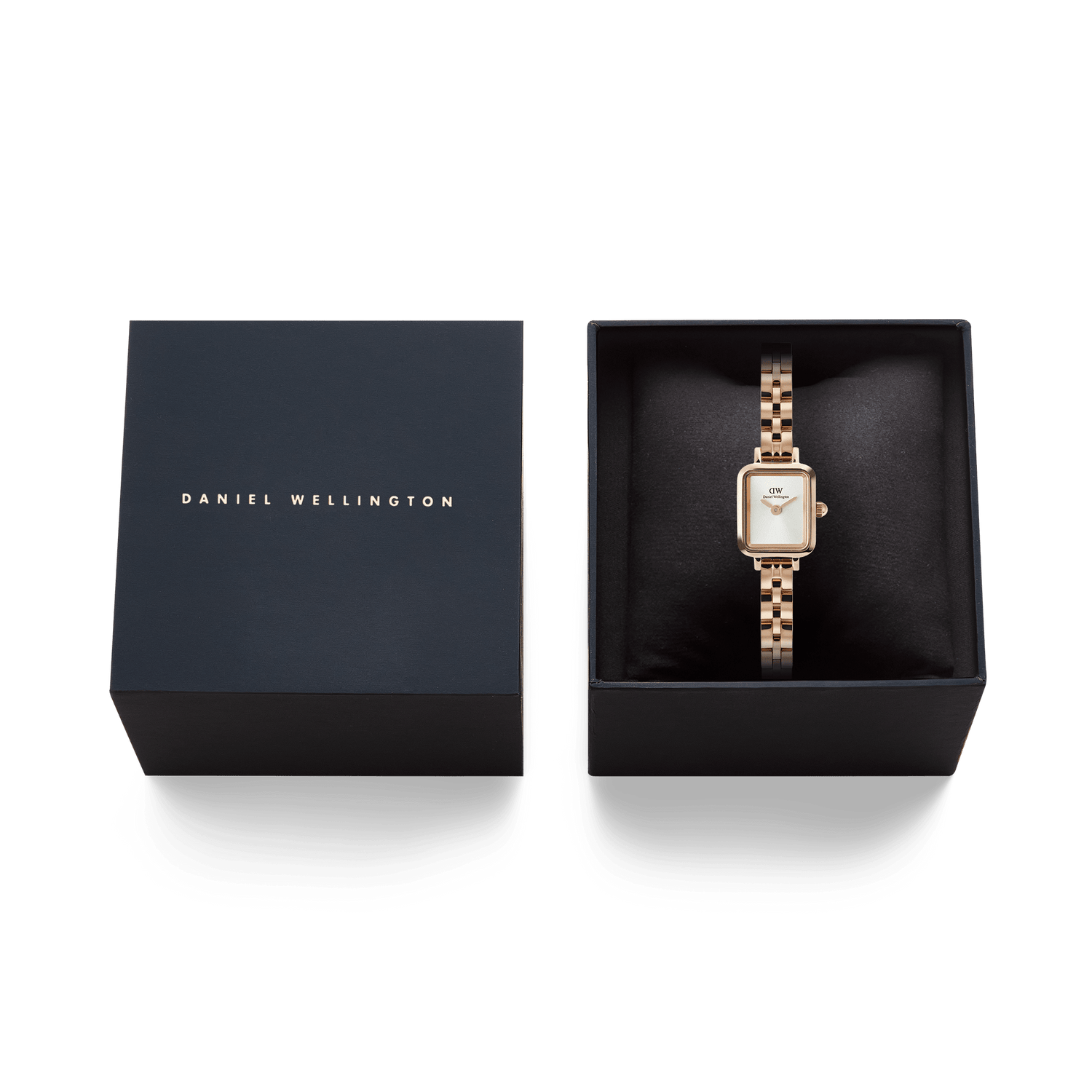 Quadro Mini Arch 3-link White Sunray Rose Gold watch presented in an elegant Daniel Wellington gift box, featuring a rectangular silver-white dial and polished rose gold-plated bracelet.