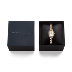 Quadro Mini Arch 3-link White Sunray Rose Gold watch presented in an elegant Daniel Wellington gift box, featuring a rectangular silver-white dial and polished rose gold-plated bracelet.