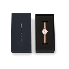 Petite Mini Blush Melrose rose gold watch with a blush pink dial and mesh strap, elegantly presented in a signature Daniel Wellington gift box.