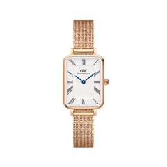 Rectangular rose gold women’s watch with a white dial, Roman numeral markers, blue steel hands, and a pressed mesh strap.