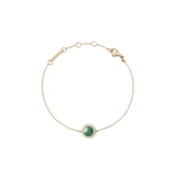 Gold bracelet with central green jade stone, surrounded by white crystals and adjustable chain, elegant and dainty design.
