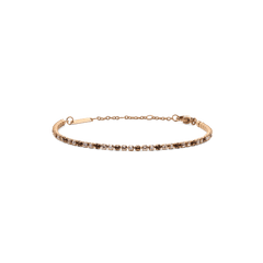 Slim rose gold tennis bracelet featuring a row of honey-toned Preciosa crystals in a delicate gradient, finished with an adjustable chain and secure lobster clasp.