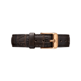 York Strap Rose Gold featuring deep brown croc-embossed genuine leather, finished with a rose gold buckle engraved with the Daniel Wellington logo and detailed stitching for a refined appearance.