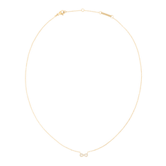 Delicate gold necklace featuring a fine chain and a central infinity symbol adorned with white cubic zirconia crystals, designed for an elegant and timeless look.