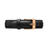 Sheffield Strap Rose Gold featuring smooth black Italian leather, detailed stitching, and a polished rose gold buckle engraved with the Daniel Wellington logo.