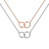 Two delicate necklaces featuring interlocking circle pendants, one in rose gold and the other in silver, displayed together to showcase their minimalist mixed metal design. The polished double rings and fine chains highlight the elegant and versatile style of the Elan Unity Necklace set.