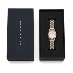 Ophelia Mini Two-Tone Rose Gold watch with an oval white dial and silver and rose gold bracelet, elegantly presented in a black Daniel Wellington gift box.