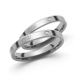 Pair of slim, polished silver-tone rings featuring subtle crystal accents and Daniel Wellington engraving, designed with a minimalist style for versatile, elegant wear.