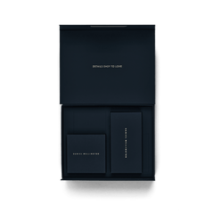 Open Premium Gift Box Blue displaying a smart interior layout with compartments and matching navy blue boxes, featuring gold Daniel Wellington branding and the phrase “Details Easy to Love” on the lid.