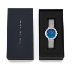 Crystalline Bezel Sterling Blue ladies watch with blue dial and mesh strap, presented in a Daniel Wellington gift box.