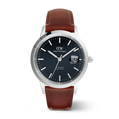 Classic men’s watch with an arctic blue enamel dial, silver markers, magnified date display, and a brown Italian leather strap.