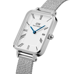 Quadro Roman Numerals Sterling women’s watch with rectangular silver case, white dial, blue hands, and mesh strap.