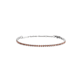 Slim silver tennis bracelet featuring a row of apricot-coloured Preciosa crystals, with an adjustable chain and secure lobster clasp.